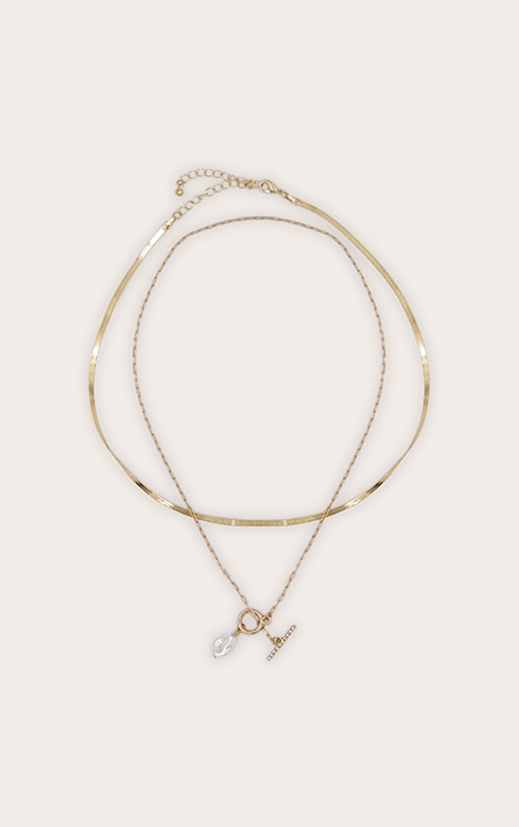 https://cdn-img.prettylittlething.com/4/b/1/c/4b1c2e52898ed6ff61d0ef5b603845f2d39e30c5_CNN3217_3_gold_layered_t_bar_necklace_with_pearl_detail.jpg