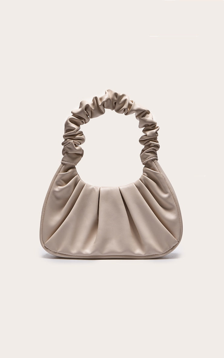 https://cdn-img.prettylittlething.com/5/4/4/4/5444ad62c41a7e5e8221668745cc48dc09fb27f9_CMM4037_1_cream_extreme_ruched_handle_shoulder_bag.jpg