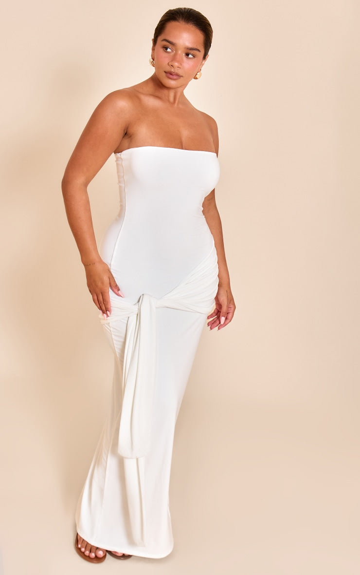 https://cdn-img.prettylittlething.com/5/5/8/8/5588101726795966f8c67a8caa905ec22577dded_CNN1860_3_shape_white_bandeau_wrap_tie_waist_maxi_dress.jpg