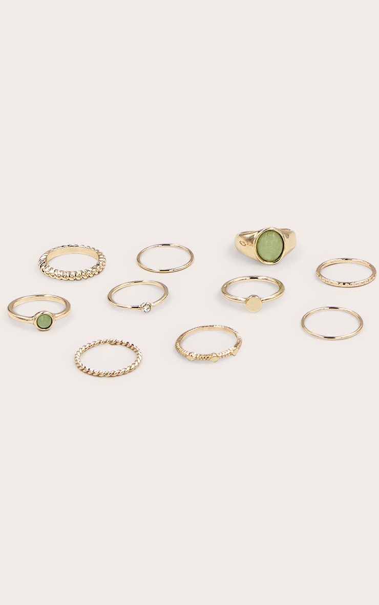 https://cdn-img.prettylittlething.com/6/6/f/e/66fe89009716403da83d92badd762699a4a1c181_CNN0366_3_gold_texture_resin_ring_multi_park.jpg