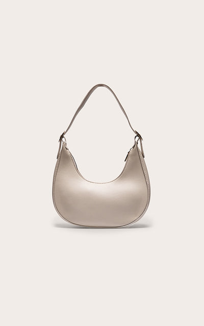 https://cdn-img.prettylittlething.com/f/8/2/9/f8298446e66ed925ade81f315836f295b4d85759_CMS9383_1_cream_curved_pu_shoulder_bag.jpg